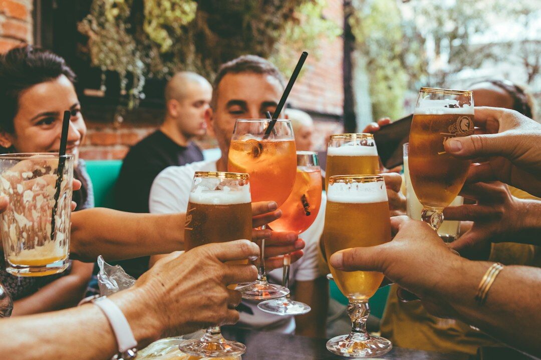 Group of friends celebrating with drinks at a party