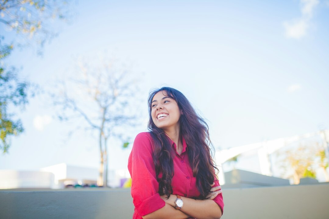 Professional portrait of a woman smiling in an office