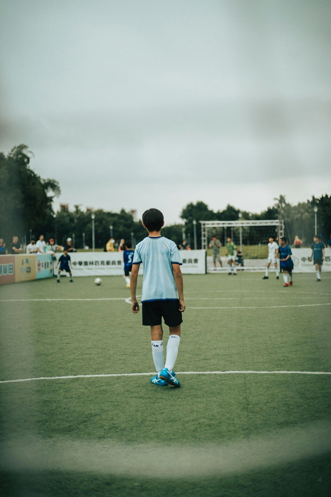 young boy playing soccer